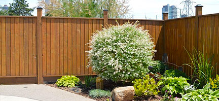 Custom Wooden privacy fences by Niagara Hardscaping Services Corner with Gate