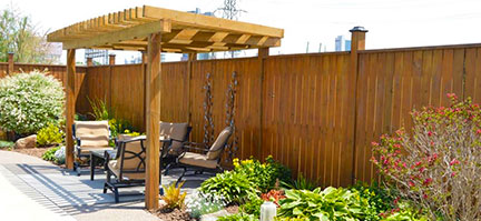 Custom Wooden privacy fences by Niagara Hardscaping Services with Pergola